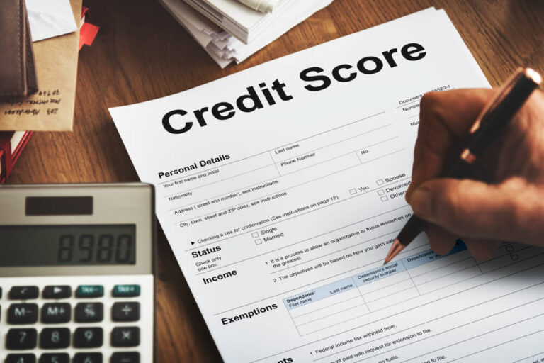 A persons Hand checking Form - credit score to buy a house