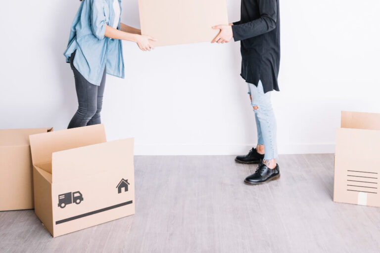 two person preparing boxes - out of state relocation