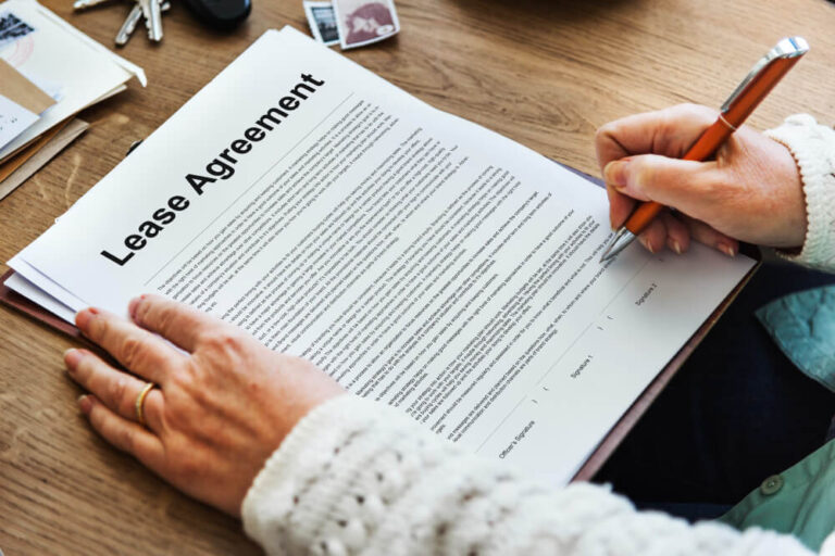 A person reviewing an agreement forms - relocation incentives